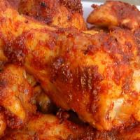 Cajun Wings · Eight seasoned bone-in or boneless wings fried to perfection and tossed in our signature Caj...