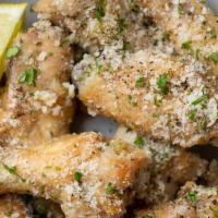 Garlic Parmesan Wings · Eight seasoned bone-in or boneless wings fried to perfection and tossed in our signature Gar...