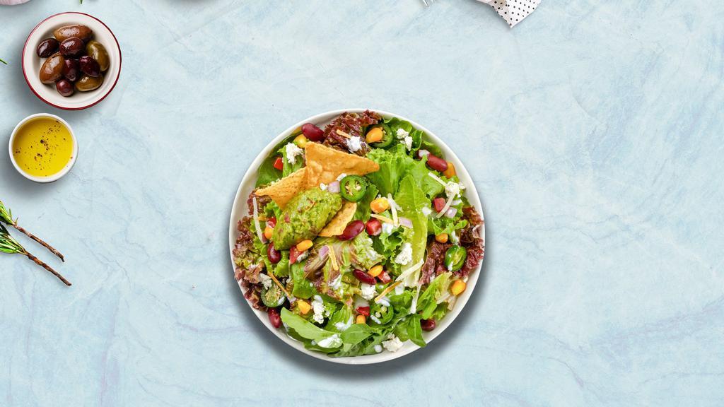Taco Loco Salad · Romaine lettuce, diced tomatoes, red onion, corn, crushed tortilla chips and vegan ground beef topped with our delicious taco salad dressing.