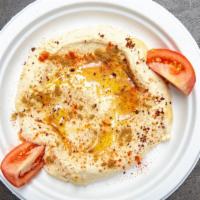 Hummus · Homemade chickpeas puree with tahini, garlic, olive oil and lemon