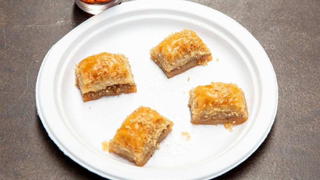 Baklava · sweet pastry made layers of filo dough filled with chopped pistachios sweetened with a light syrup and honey .