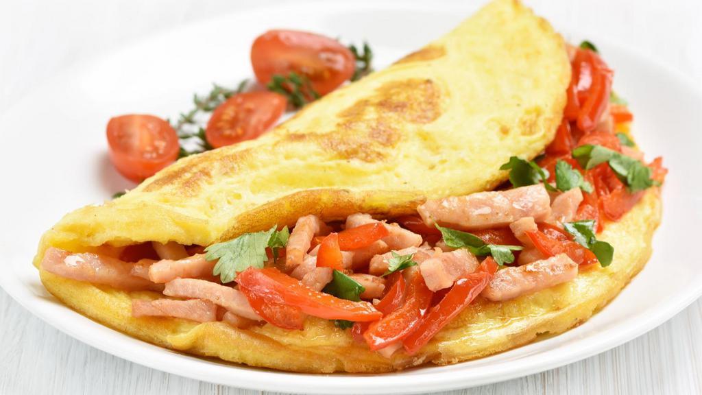 Bacon, Ham & Sausage Omelette Platter · Exquisite platter  with bacon, ham, and sausage cooked and wrapped in omelette style. Served with toast and home fries.
