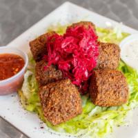 Falafel Platter · 5 pieces of falalfel served yellow rice and choice of 3 toppings. sauce tahini sauce White s...
