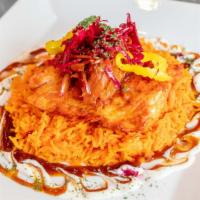 The King'S Sea Platter · Baked salmon over a bed of rice with sauteed onions, chopped with tahini, lettuce topped wit...