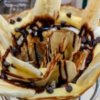 Kiss A Banana · Bananas, chocolate chips, in-house whipped cream, in-house custard cream, chocolate sauce.