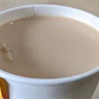 Hot Milk Tea · Served hot with whole milk.