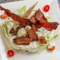 Wedge Of Iceberg Lettuce · Crumbled Blue Cheese, Crispy Bacon