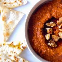 Muhammara Dip · A sweet and savory must try! Roasted red peppers, toasted walnuts, breadcrumbs and pomegrana...