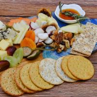 The Classic Happyboard (Vegetarian) · Imported Gouda Cheese, Pecorino Truffle, Triple Cream Brie, Dried Figs, Dried Apricots, Seas...