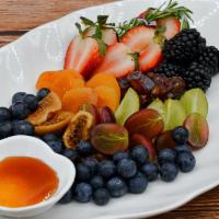 The Fruity Happyboard · Strawberries, Blackberries, Blueberries, Grapes, Sliced Apples, Dried Apricots, Dates, Dried...