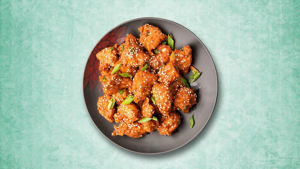 Smackin' Chilli Chicken · Wok Tossed Chicken with a crispy outing and is soft and juicy on the inside, smothered in sticky, saucy, sweet, and tangy flavor.