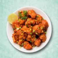 Zesty Cauliflower Bomb · A popular Indo Chinese dish with crispy fried cauliflower florets, tossed in a spicy sauce g...