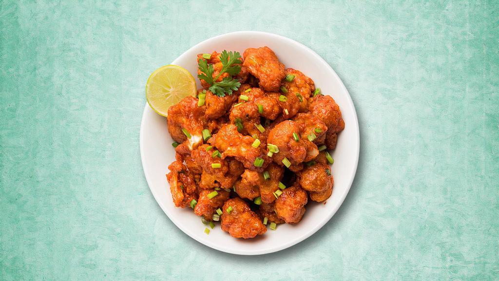 Zesty Cauliflower Bomb · A popular Indo Chinese dish with crispy fried cauliflower florets, tossed in a spicy sauce giving a tangy aftertaste.