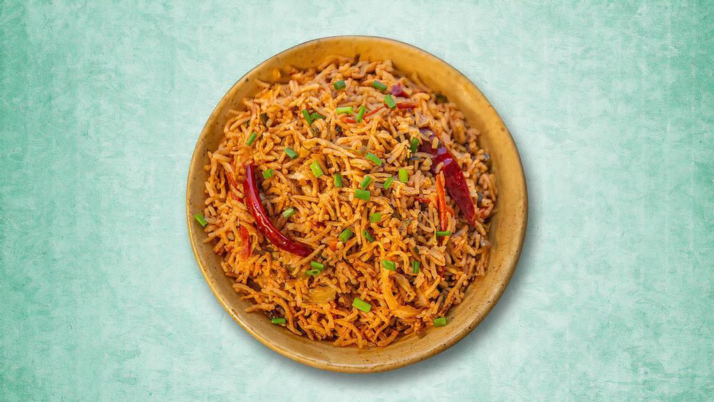 Fiery Vegetarian Fried Rice  · A popular Indo Chinese dish made by stir-frying the rice with choice of vegetables and schezwan sauce.