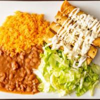Pollo Flautas With Rice & Beans · Chicken. Four pieces rolled up corn tortillas filled with your choice of meat, topped with l...