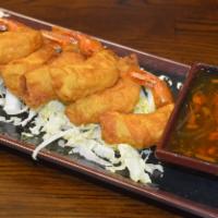 Goong-Gar-Borg (Best Seller) · Fried shrimp wrapped in egg roll skin, served with sweet and spicy sauce.