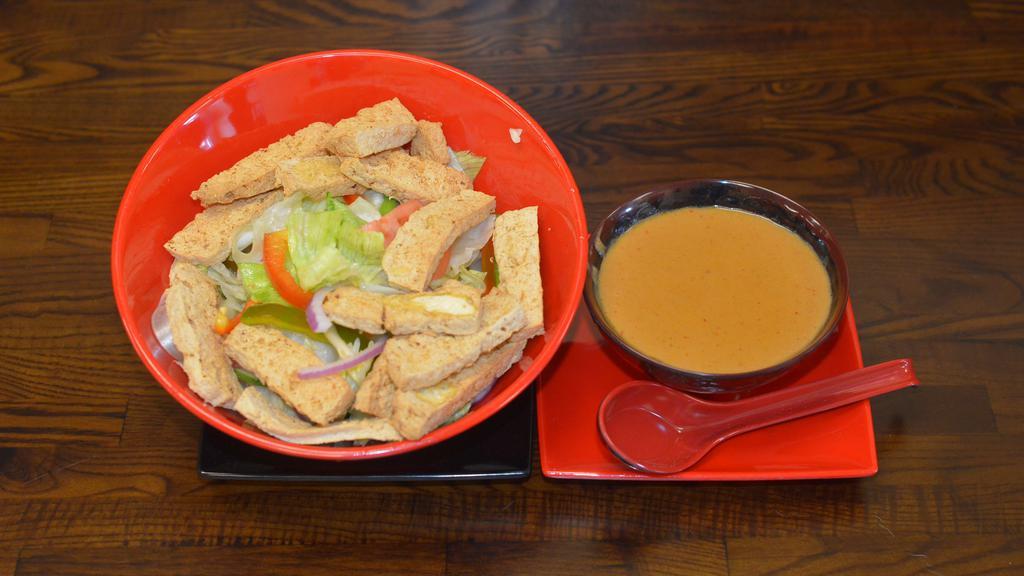 Salad Khag (Thai Salad) (Best Seller) · A refreshing mixture of lettuce, cucumbers, fried tofu served with a spicy peanut
dressing