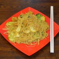 Pad Mie Singapore (Best Seller) · Stir fried thin rice noodles shrimp, roast pork, onions, sesame, egg & curry powder