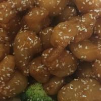 Sesame Chicken · Served with pork fried rice and one free choice of wonton egg drop soup or can soda or egg r...