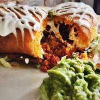 Chimichanga · Fried burrito filled with yellow rice, Oaxaca cheese, and sour cream. Served with guacamole ...