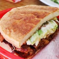 Torta · Sandwich from Mexico with jalapños, black beans, Oaxaca cheese, avocado, tomatoes, and mayo.