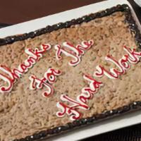 Half A Sheet Cookie Cake  · Semi-Sweet Chocolate Chip.
(Free Decoration)
Serves 22 people