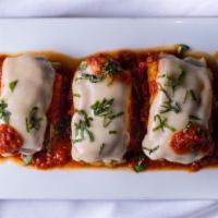 Eggplant Rollatini · Thinly sliced eggplant, lightly floured and breaded, stuffed with fresh ricotta and served w...