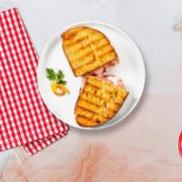 The Turkey Panini · Honey glazed turkey, Jarlsberg cheese, coleslaw and honey mustard served on toasted bread.