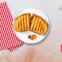 Bussin Beef Panini · Roasted beef, muenster cheese, caramelized onions lettuce, plum tomatoes and Russian dressin...
