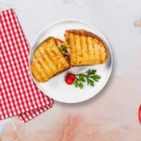 Cheeky Italian Panini · Grilled chicken, mozzarella cheese, roasted peppers and pesto sauce served on toasted bread.