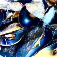 Mussels · Shallot, roasted tomatoes, basil chardonnay butter broth.