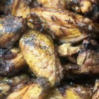 Smoked Chickee Wings · Choice of 6 or 12 smoked chicken wings served with celery, carrots, and ranch dressing on th...