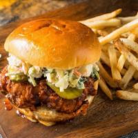 Nashville Hot Chickee Sandwich · Southern fried spicy chicken with Nashville spices topped with coleslaw and pickles.