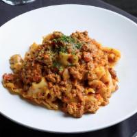 Mafaldine Bolognese · Veal Ragu “Bolognese” • San Marzano Tomato • Pecorino Romano