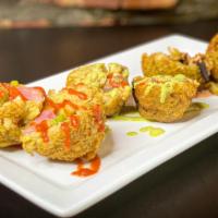 Mangu Munchers  · Deep fried Mangu stuffed with choice of chicken, vegetables or saltfish.