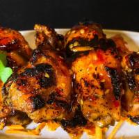 Wi' Grilled Wings · Marinated wings, grilled to perfection and tossed in one of our signature sauces.