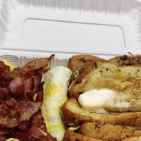 French Toast Platter · 2 EGGS, 3 SLICE FRENCH TOAST AND PORK 
BACON SERVED WITH SYRUP