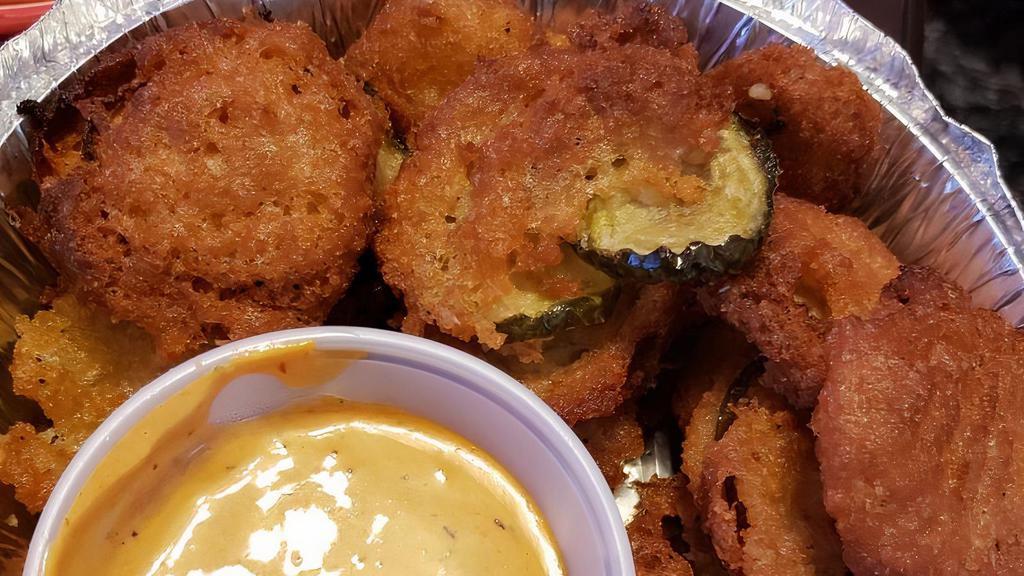 Fried Pickle Chips · Breaded and fried pickles with a chipotle ranch dipping sauce.