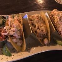 Fish Tacos (3) · Beer Battered Cod Fish in a soft flour tortilla topped w  A Spicy Slaw served w Sour Cream