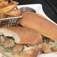 Shrimp Po'Boy · Bread fried shrimp, fried pickle chips, lettuce, tomato, tartar sauce on toasted roll.