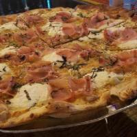 White Ricotta Prosciutto & Basil Large 18' Pizza · Thin crust topped with sliced prosciutto and basil.