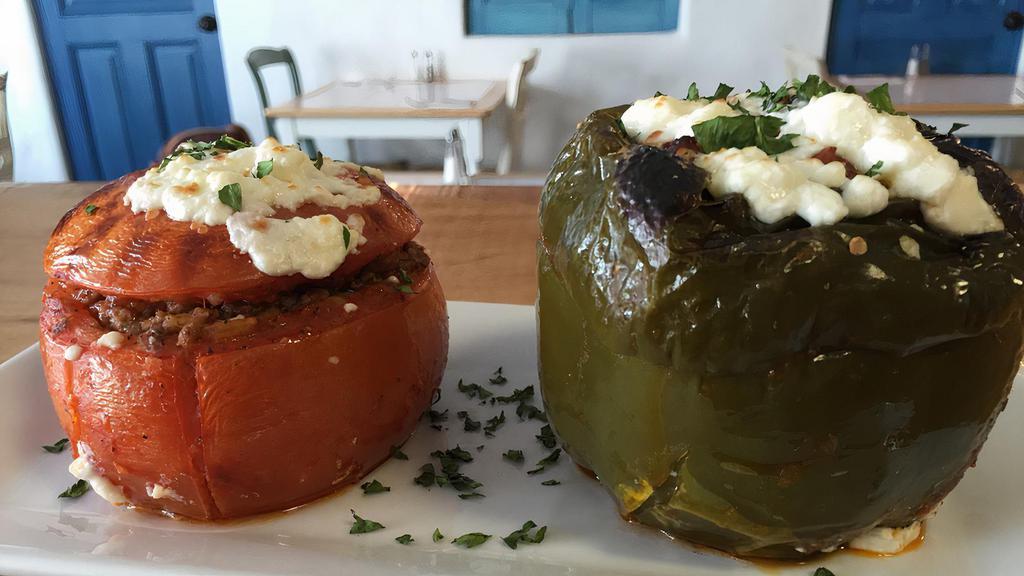 Yemista · Peppers and tomato stuffed with ground beef, rice, and Feta cheese.