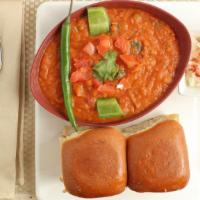 Pav Bhaji · Thick flavory vegetable curry, fried and served with a soft bread roll.