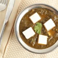 Palak Paneer · Cottage cheese cubes cooked in spinach sauce. (Recommended with Paratha)