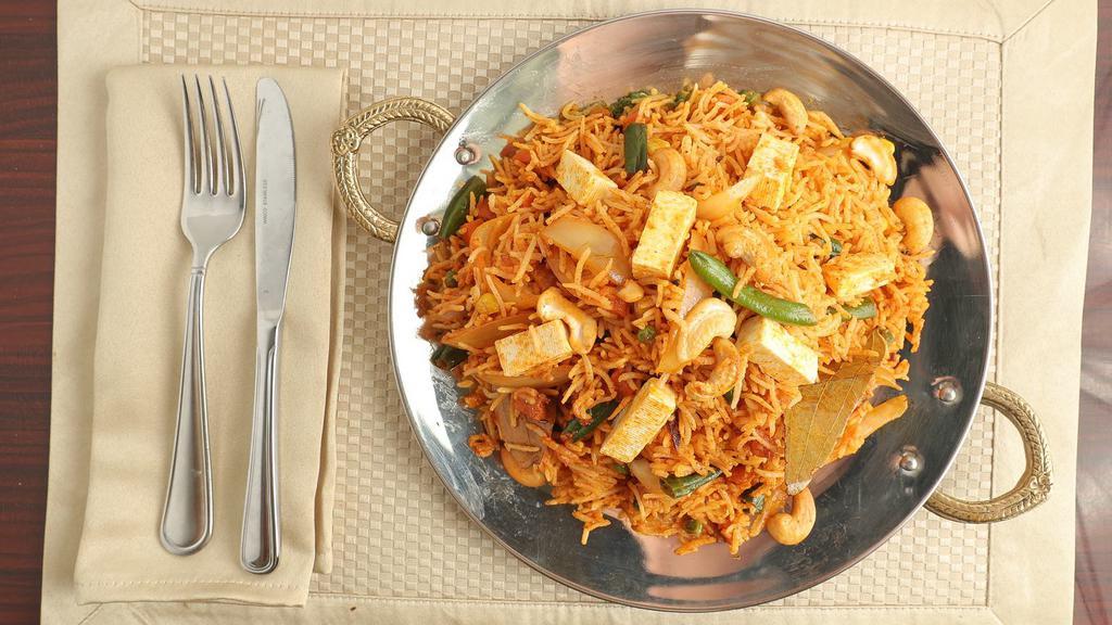 Vegetable Biryani · Basmati rice cooked with selection of fresh vegetables, herbs, and spices.