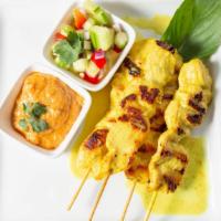 Satay · Grilled chicken skewers marinated with coconut milk served with thai peanut sauce and cucumb...