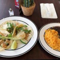 Tacos · 3 (three) soft corn tortillas come with onions, cilantro, served with yellow rice, and black...