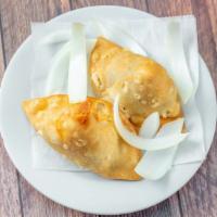 Samosa · Two pieces. Lamb, chicken, vegetable and coconut filled crispy and spiced patties. Two for s...