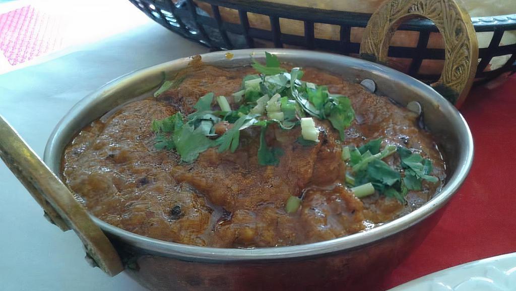 Beef Vindaloo · Highly spiced meat cooked with potatoes in a tangy sauce.