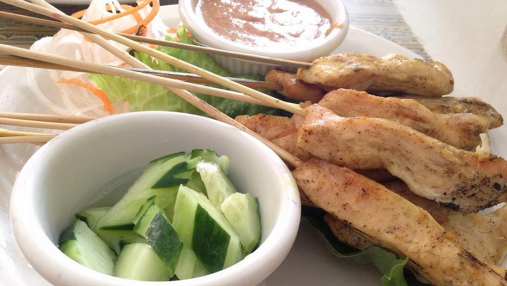 Chicken Satay · Yellow Curry & Coconut Marinated Grilled Chicken Skewers with Peanut Sauce, Cucumbers & Daikon Salad